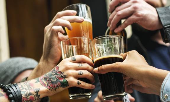 friends celebrating and clinking glasses